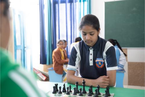 Students playing chess