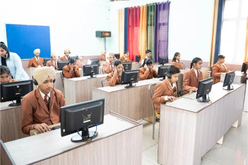 Students learning in the computer lab